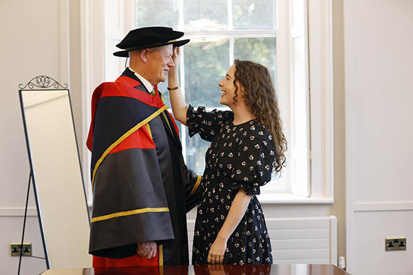 Chief Justice Donal O'Donnell receives an Honorary Doctorate from Dublin City University, admired by his daughter Aoife style=