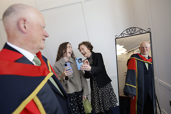 Chief Justice Donal O'Donnell receives an Honorary Doctorate from Dublin City University, admired by his daughter Aoife and his wife Mary Rose Binchy style=