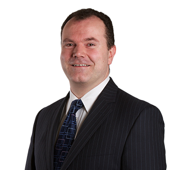 Headshot of Law Society Council member Dr Shane McCarthy