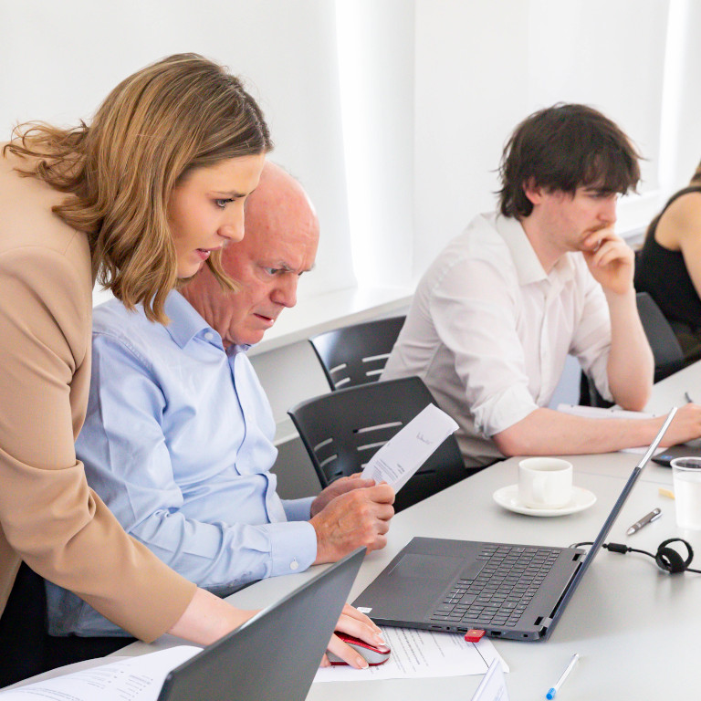 Solicitors using technology together