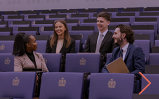 Group of students sitting in a lecture theatre 