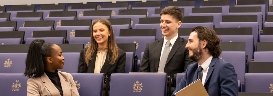 Group of students sitting in a lecture theatre 