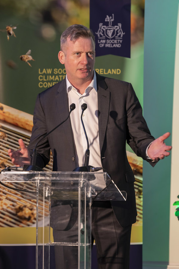 Director General Mark Garrett speaking at a Law Society event